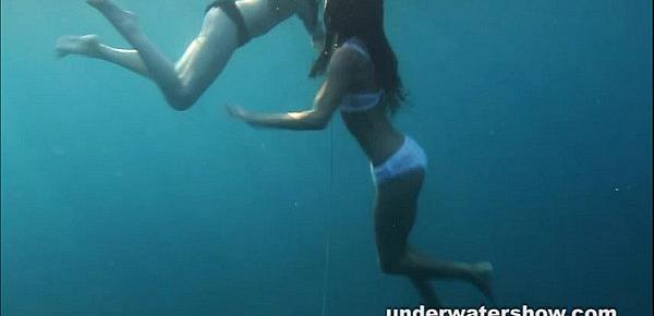  Nastya and Masha are swimming nude in the sea